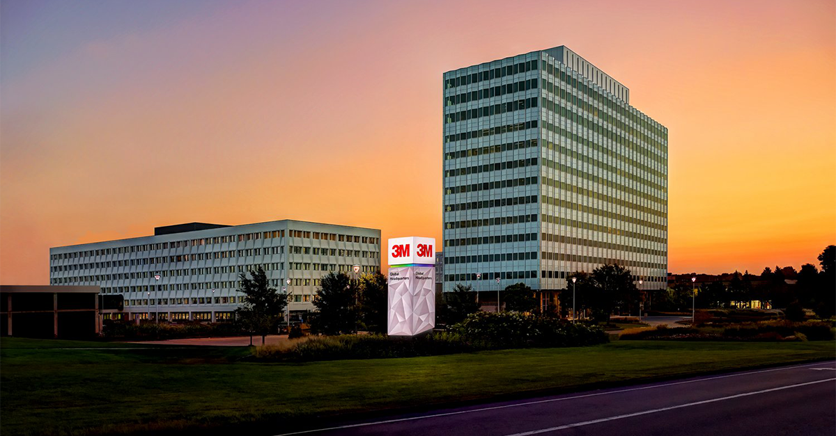 Exterior view of 3M global headquarters and monument sign at sunset.